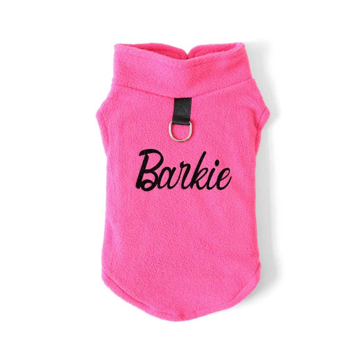 Pink barkie vest, jacket, clothes for dogs with black writing on the back. Has a attachable lead holder
